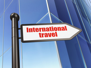 Vacation concept: sign International Travel on Building background