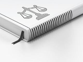 Law concept: closed book, Scales on white background