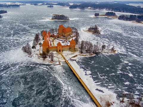 Trakai, Lithuania: aerial winter UAV top view, flat lay of gothic Island Castle. Historical residence in capital city of Grand Duchy of Lithuania, located in Galve lake
