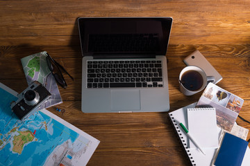 planning travel map tea laptop map on the desk