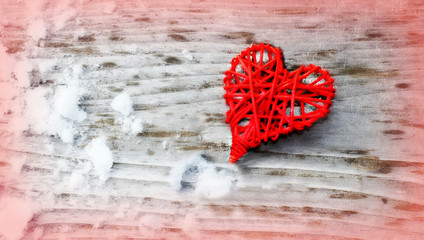 Red Love Heart. Valentine's background. Greeting card. Heart symbol against wood and snow background.