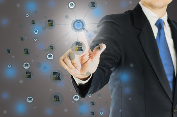 Businessman is pointing, pushing, or touching forward over white