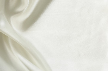 Closeup of white folded silk fabric
