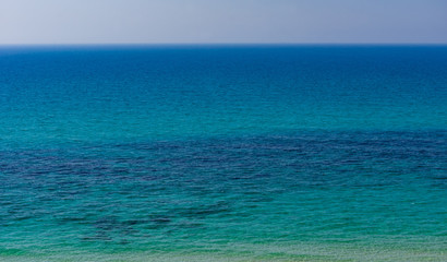 The clear blue sea to the horizon.