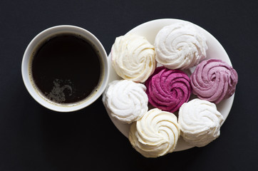 colored zephyr  with a cup of coffee on black background
