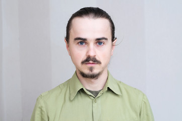 Mustache man portrait looking at camera, handsome young men full face,bearded and serious