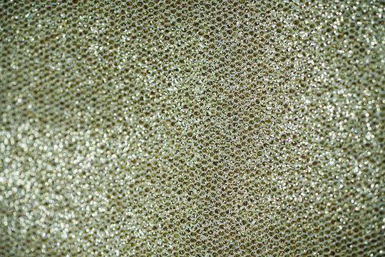 Golden textured fabric abstract background