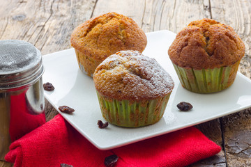 Muffins on a wooden table