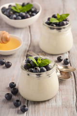Natural homemade yogurt with blueberry and mint, selective focus