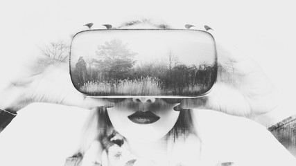 Attractive woman wearing virtual reality glasses. VR headset. Doble exposure virtual reality...