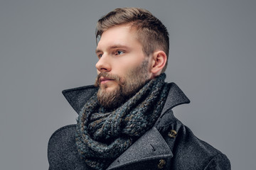 Portrait of bearded man  in a grey jacket.