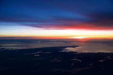 OSLO, NORWAY - JAN 21st, 2017: View off the sunrise, norway during winter from inside the plane during my Lufthansa business class flight to Munich.