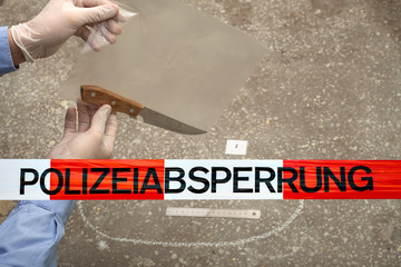 Police tape in Germany at the crime scene with the inscription in German 