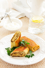 Pancakes stuffed with liver and eggs.