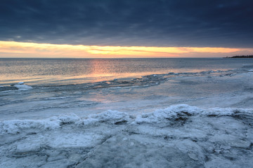 Fototapeta premium Winter landscape on the Baltic Sea. Cold winter evening in Jastarnia. Poland.