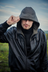 Bald man outdoor portrait.Man posing with leather jacket