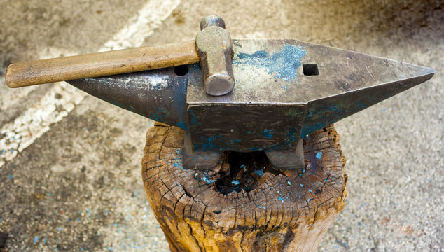 Hammer and anvil used by a blacksmith.