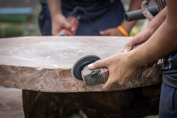 Close-up of a Carpenter working on a wooden furniture