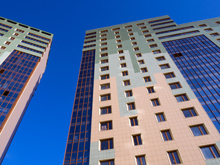 Modern high-rise apartment houses with ventilated facade