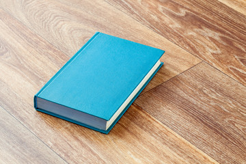 The book blue colour in a firm cover.
