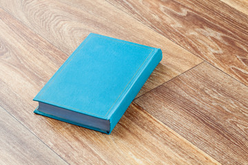 The book blue colour in a firm cover.
