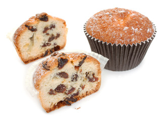 Halves of homemade muffins with raisins, and the whole muffin cl