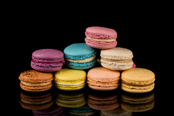 Colorful macaroon over black background