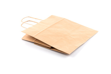 Paper shopping bag on white