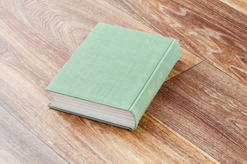 The book olive colour in a firm cover.