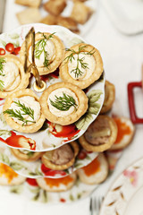 many different tartlets with pate on a festive table