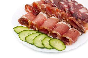 Sliced homemade dry sausages and meat products, cured meat, baco