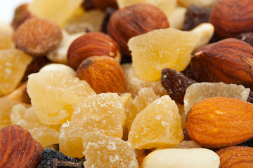 Mixture of nuts and candied fruits isolated on a white backgroun