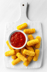 Breaded mozzarella cheese sticks with tomato basil sauce