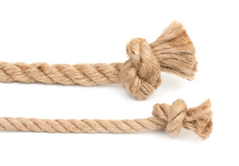 Pair of ropes are different diameters with knots isolated on a w
