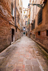 Fototapeta na wymiar Small street in Venice (Italy