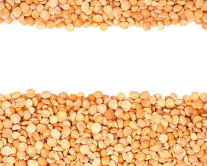 Background with dried yellow peas close-up, top view with epmty