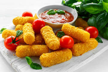 Breaded mozzarella cheese sticks with tomato basil sauce