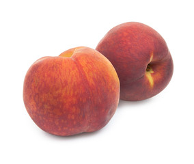 Pair of fresh red peach isolated on white