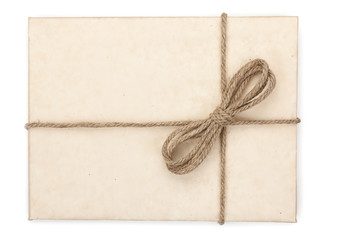 Parcel wrapped, gift box with brown kraft paper and tied with tw
