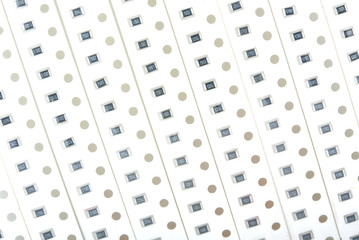 Perforated tapes with SMD chip resistors for soldering by robot