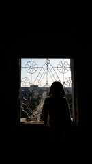 Sillhouette girl at the window at Patuxay, Vientiane