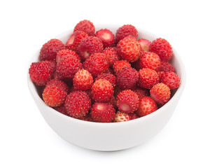 Wild strawberry in little ceramic bowl isolated on a white backg