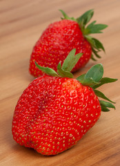 Fresh red berries strawberries on old wooden background. Close-u
