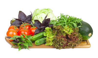 Fresh organic vegetables for cooking food on wooden cutting boar