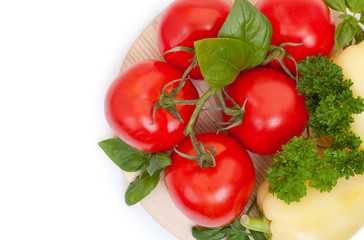 Branch of fresh tomatoes, bell pepper with fresh parsley and bas