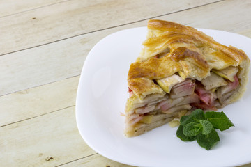 Traditional American apple pie on light wood background