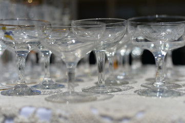 Empty glasses for party celebration event on light background. Closeup image