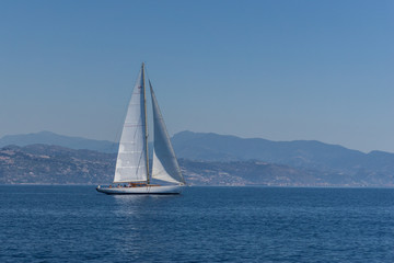 Fototapeta na wymiar Yacht Sailing on water of ocean