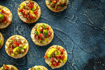 Salsa canape cracker appetizers with soft cheese