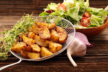 Baked potatoes with herbs and salad